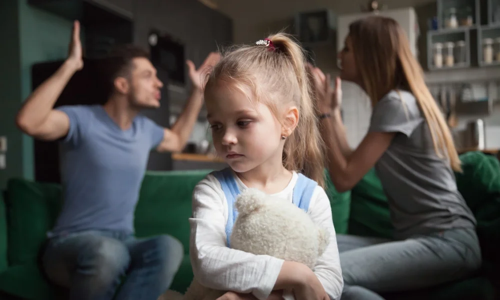 Couple-arguing-in-front-of-child